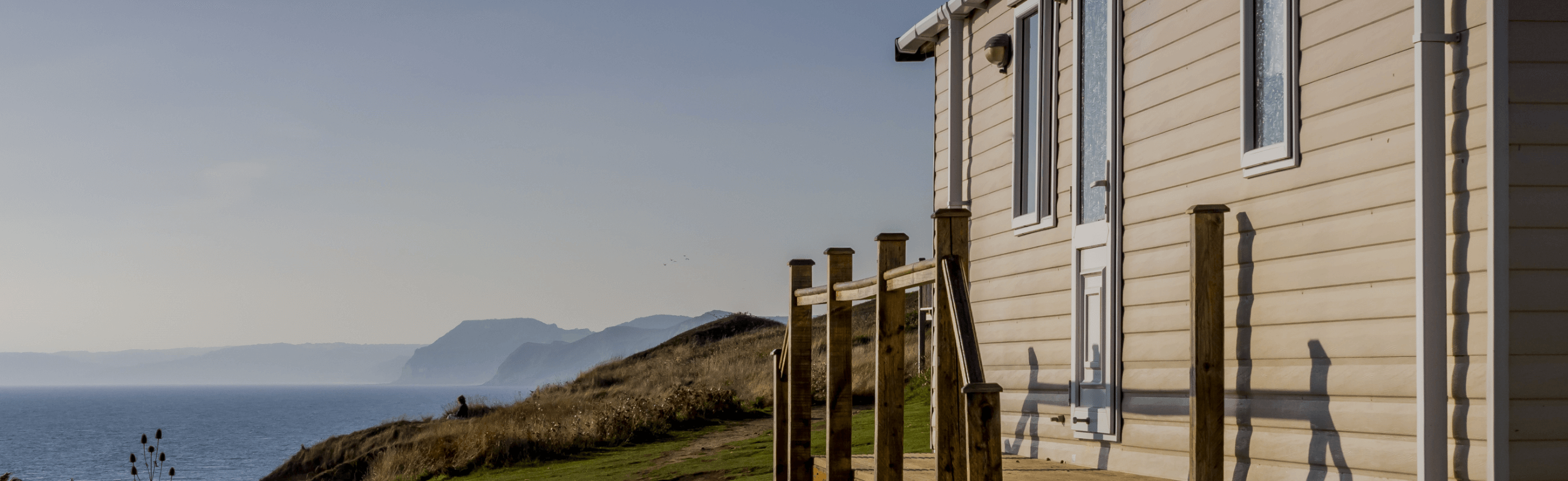 Photograph of caravan exterior with sea view